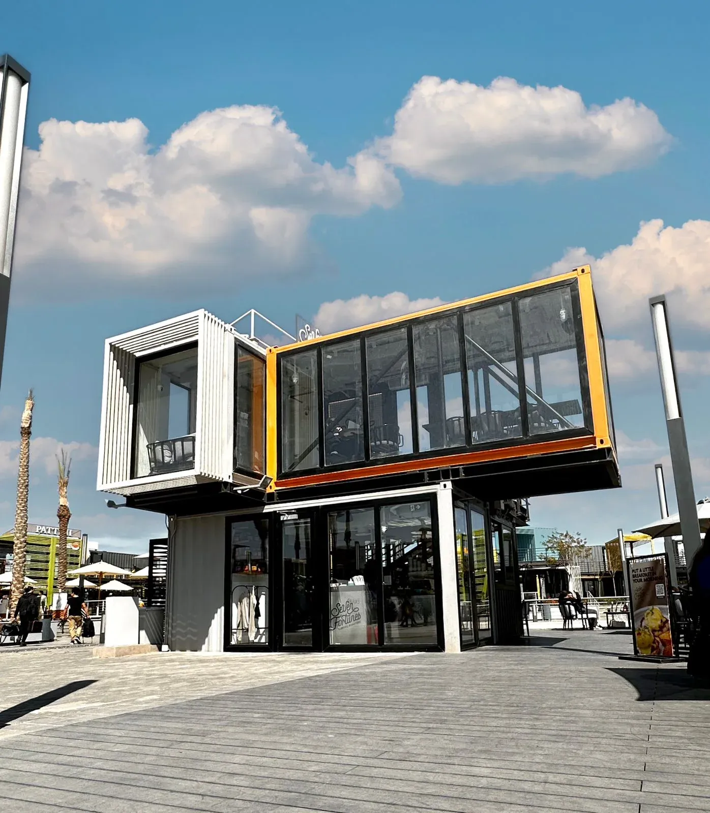 Two-level cafe with the upper box cantilevered over the ground floor