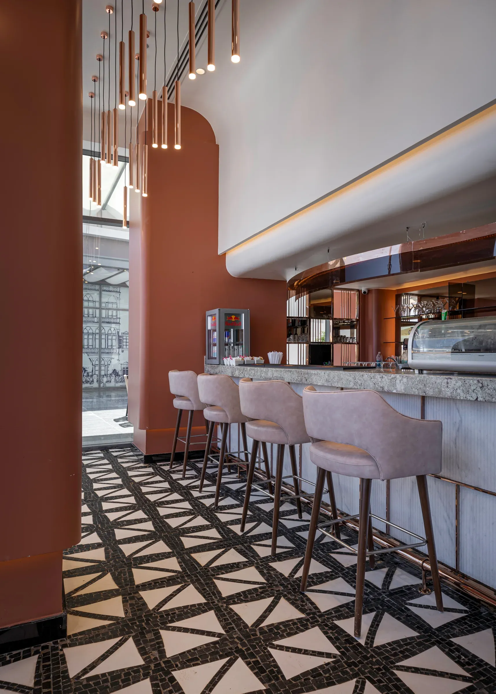 Bar from the far end with stone-faced counter and green screens