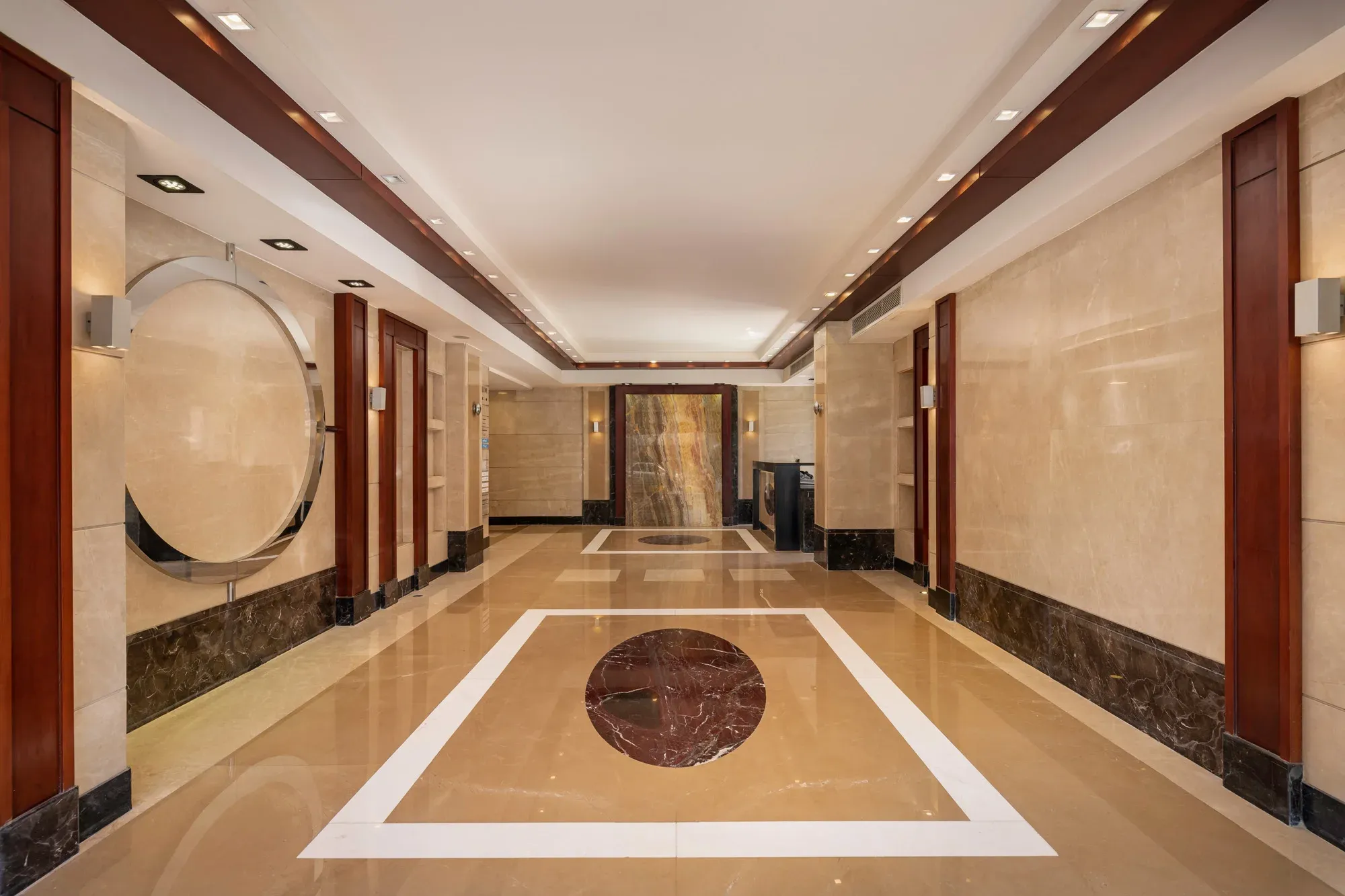 Lobby corridor with circular inlay seen from the entrance side