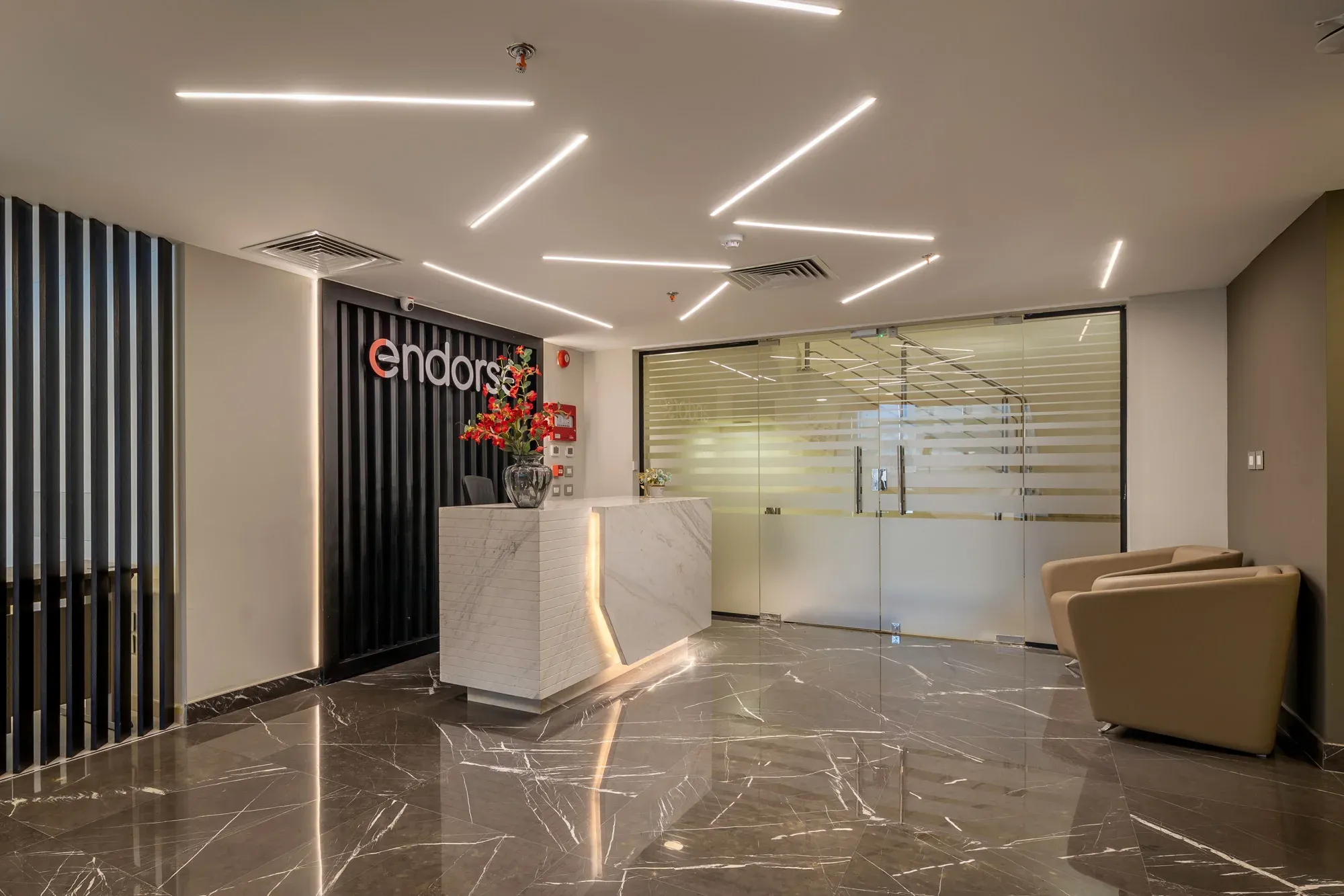 Endorse reception with lounge chairs and a glazed meeting room beyond