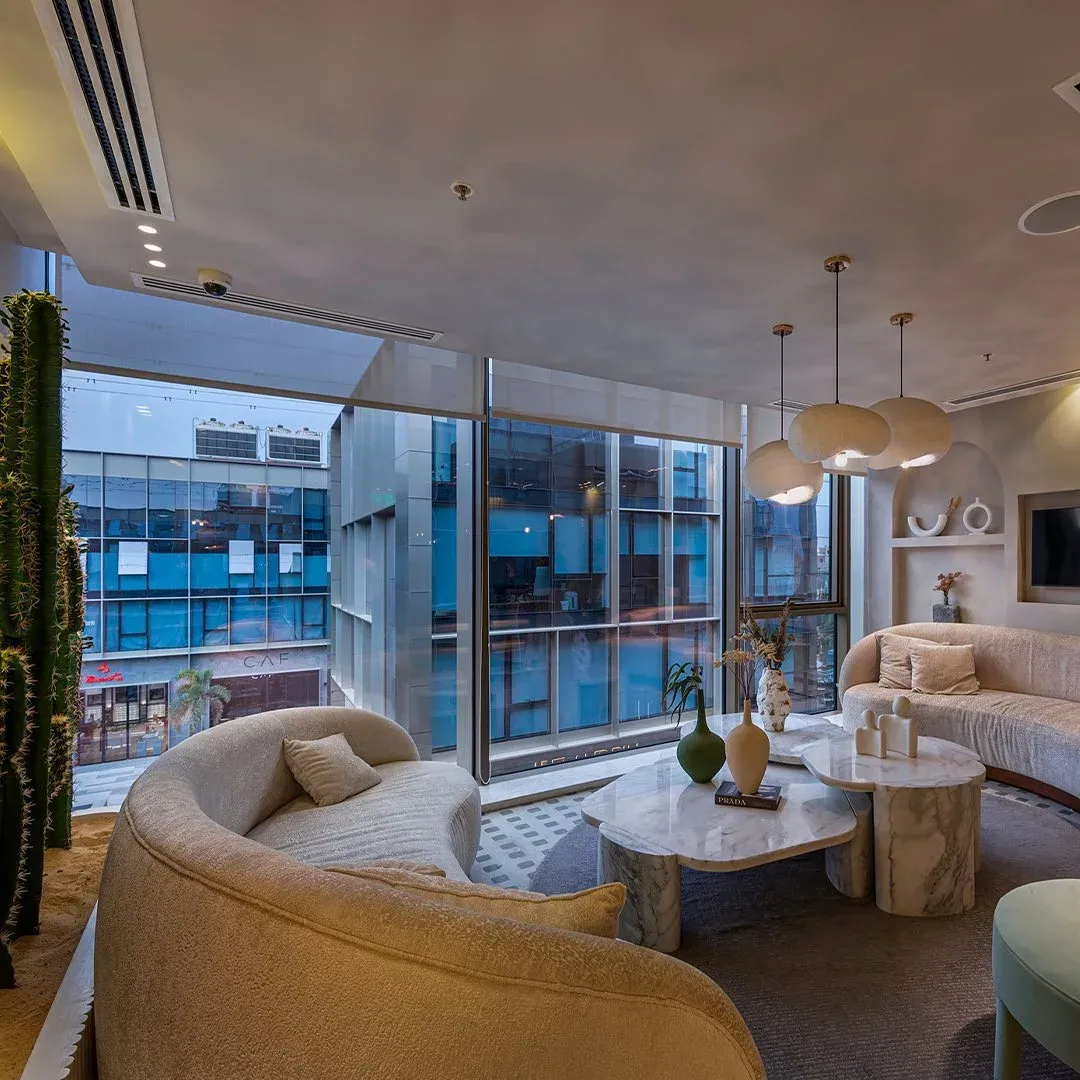Wide view of the lounge looking out through floor-to-ceiling glass
